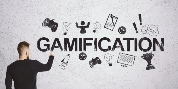 Person pointing at a sign with the text Gamification